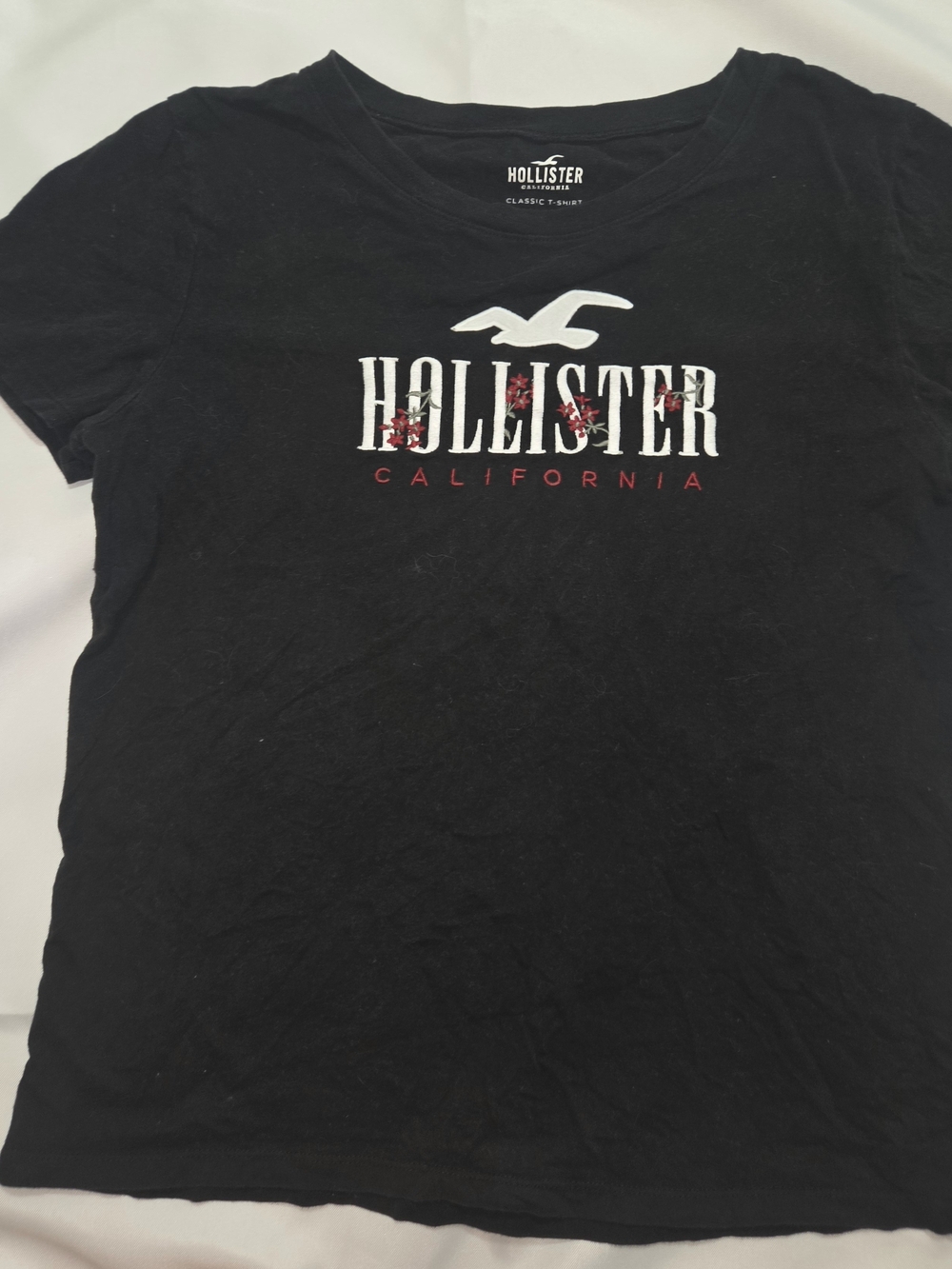 Hollister Black Tee with White Seagull and Red Floral Logo